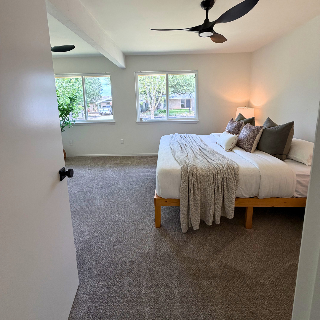 Bedroom dusted and vacuumed after a cleaning visit